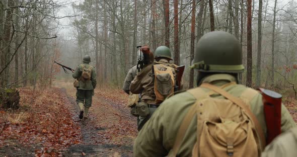 Historical Re-enactment. Re-enactors Dressed As American Soldiers Of USA Infantry Of World War II