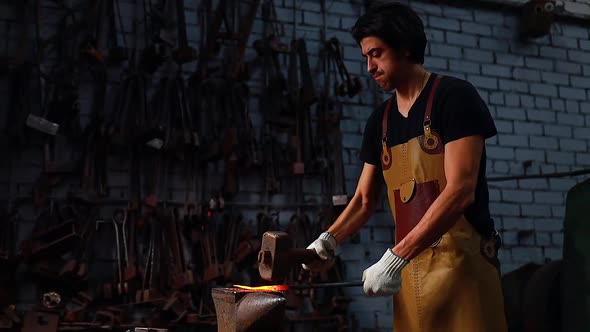 Slow Motion Video Authentic Handsome Indian Man in Leathern Apron Hammer Industry Small Business