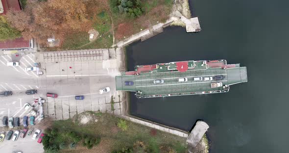 top down view of ferryboat transferring cars. Ferry transfers cars and passengers to the other side