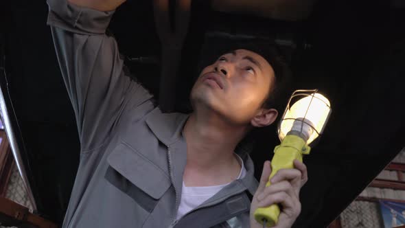 Worker checking car