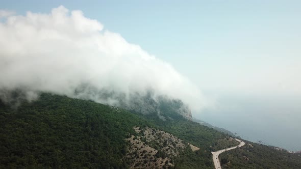Crimea with Beautiful View of Mountains and Highway Road Between the Mountains. Aerial View Of Fast