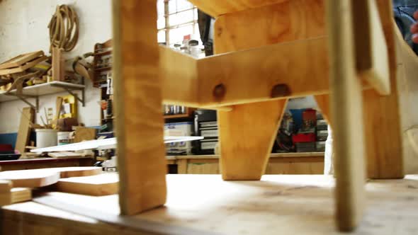 Carpenter making a chair