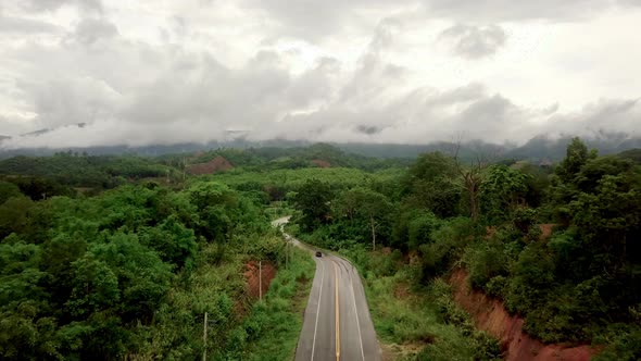 Aerial RoadAerial View Of Countryside Road Passing Through The Mountain Landscape