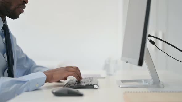 Businessman Typing on Keyboard of Desktop Close Up