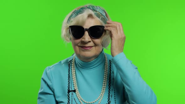 Elderly Stylish Grandmother. Caucasian Woman Posing on Chroma Key Background