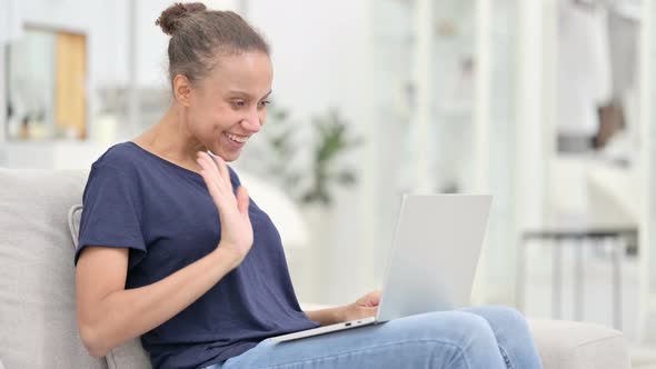 Happy African Woman Doing Video Call on Laptop at Home 