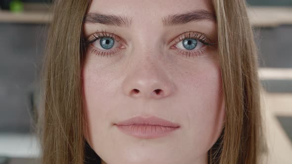 Close-up Attractive Young European Woman Model Looking at Camera at Home. Portrait