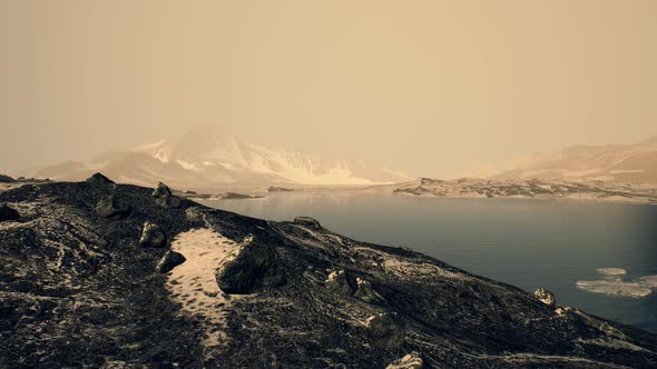 Coastline of Antarctica with Stones and Ice