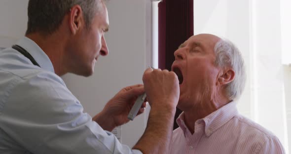 Doctor examining a senior man in a retirement home