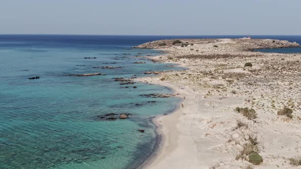 Wild natural beach of Crete island, aerial drone flying over view