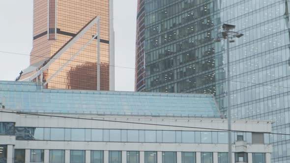 Urban View From Train Window. Glass Skyscrapers Moving Along.