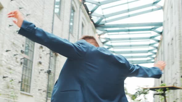 Young successful caucasian businessman works outdoor