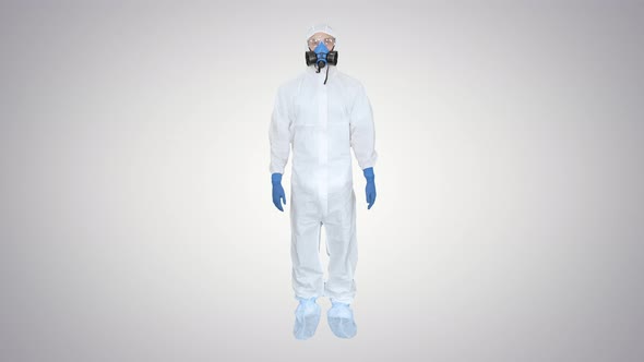 Man Wearing Protective Mask and Hazmat Suit Crossing Hands and Showing Stop Gesture on Gradient