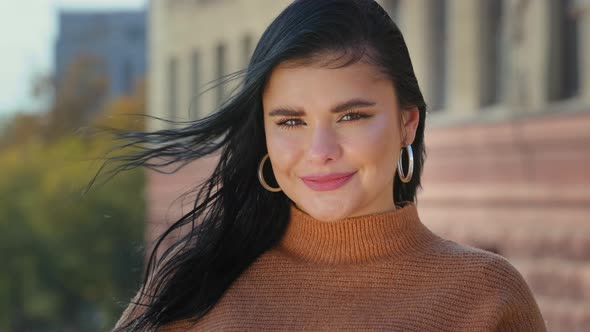 Young Attractive Hispanic Girl Student Model Looking at Camera Posing Standing Alone Outdoors for