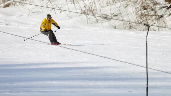 Man Skier Running Downhill