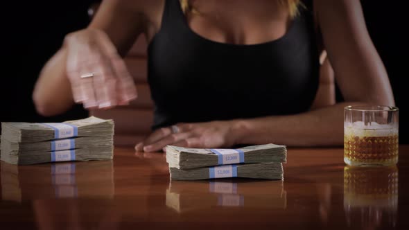 Sexy woman with a stack of money