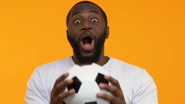 Excited Black Guy Football Hands Celebrating Team Goal, Sport Victory, Success