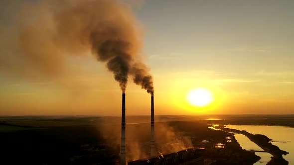 Steam on chimney of power plant. Air pollution from power plant chimneys