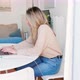 Woman typing on laptop in living room, Milan, Italy - VideoHive Item for Sale