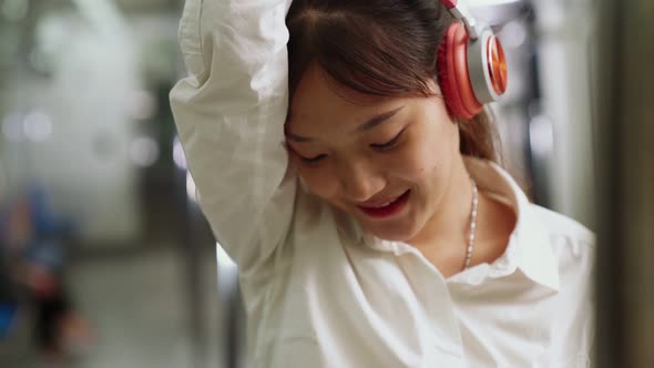 Young Woman Using Mobile Phone on Public Train