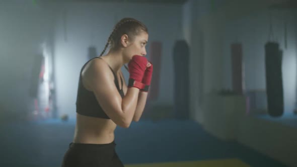 Woman Power Caucasian Female Fighter Trains His Punches and Defense in the Boxing Gym a Boxer Trains