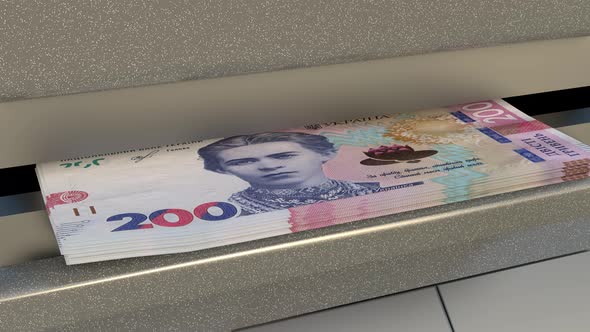 200 Ukrainian hryvnia in cash dispenser. Withdrawal of cash from an ATM.