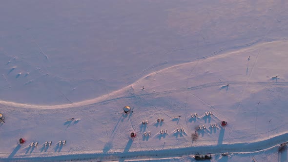 Beautiful Aerial View of Frozen Reservoir in Rays of the Setting Sun