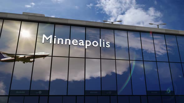 Airplane landing at Minneapolis Minnesota, USA airport mirrored in terminal