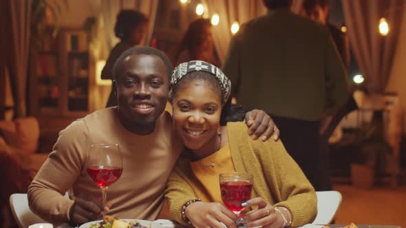 Young Couple With Glasses Of Wine