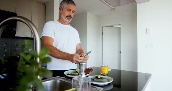 Man preparing breakfast in kitchen 4k