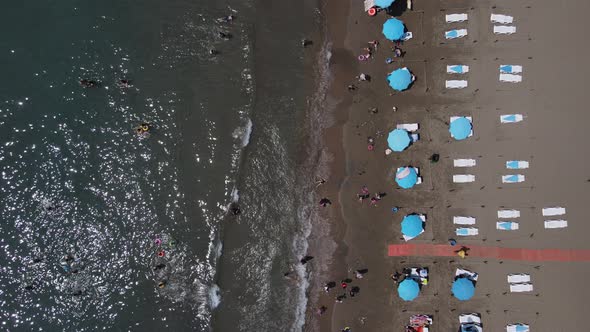 Beach People Sunbathing Swim Drone