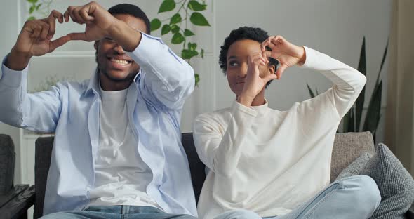 Portrait of Afro American Couple Girlfriend and Boyfriend Sitting Together on Sofa at Home in Living