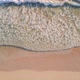 Aerial View of Ocean Blue Waves Break on a Beach - VideoHive Item for Sale