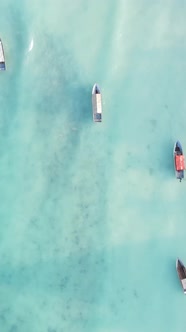 Vertical Video Boats in the Ocean Near the Coast of Zanzibar Tanzania