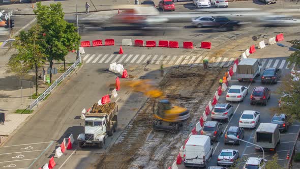 Industrial Truck Loader Excavator Moving Earth and Unloading Into a Dumper Truck Timelapse