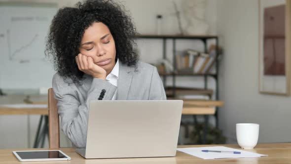 African Businesswoman Sleeping at Work