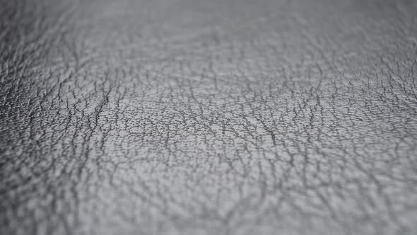 Leather black material texture Wrinkled Abstract natural pattern. Gray upholstery fabric. Macro sho