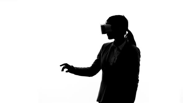 Businesswoman in Virtual Reality Headset Entering Options Startup Planning