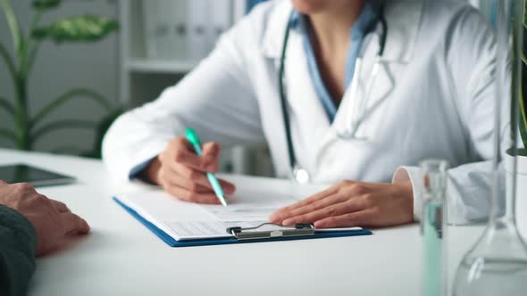 Doctor Writes Prescription For Medication. Young Physician With Stethoscope Prescribes Treatment