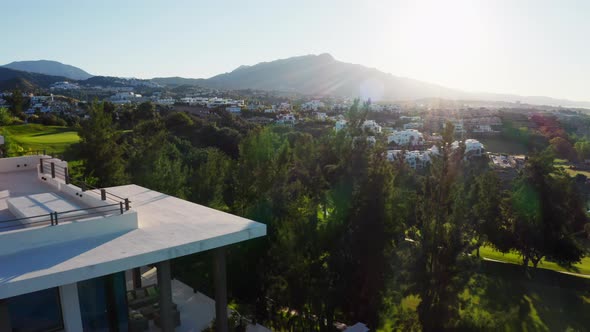 Drone Over Luxury Property With Infinity Pool At Sunrise