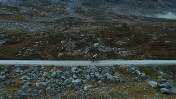 Epic Side Drone View of Cyclists Training on Road