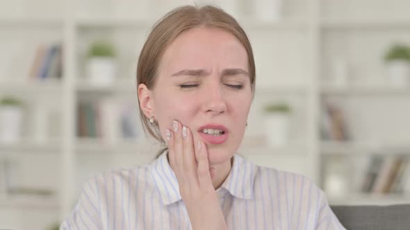 Young Woman Having Toothache While Drinking Cold Water 