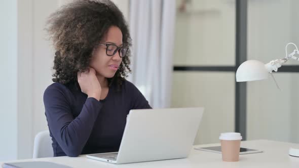 African Woman Having Neck Pain While Using Laptop