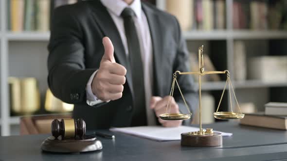 Close Up Shoot of Lawyer Hand Showing Thumbs Up in Court Room