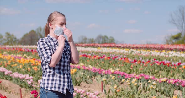 Woman Putting on Protective Mask Against Coronavirus Covid-19.