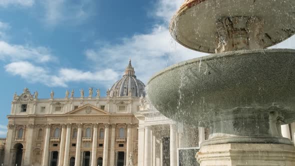 Fountain against Saint Peter's Basilica at Vatican square.