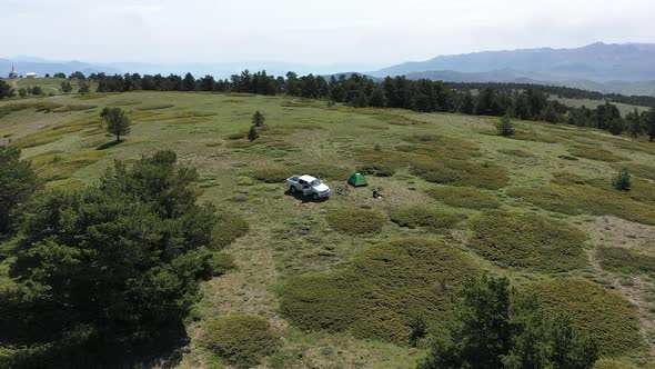 Aerial View Of Man Camping On Mountain Top