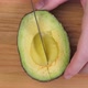 Cuttong Avocado Half With Knife On Cutting Board 01 - VideoHive Item for Sale
