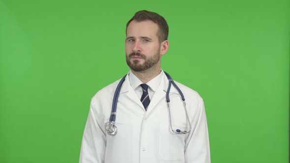 Ambitious Doctor Doing No Sign By Head Against Chroma Key