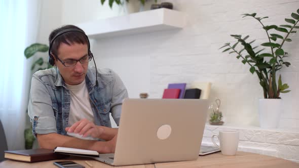 Businessman Working on Laptop Computer at Home Office